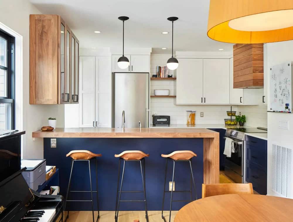 navy blue kitchen cabinets with butcher block countertops