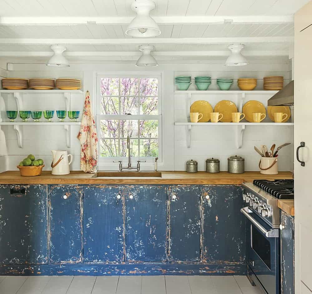 dark blue kitchen cabinets with gold hardware