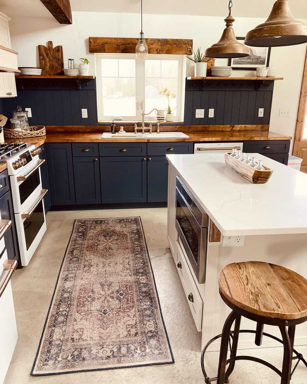 navy blue kitchen cabinets with gold hardware