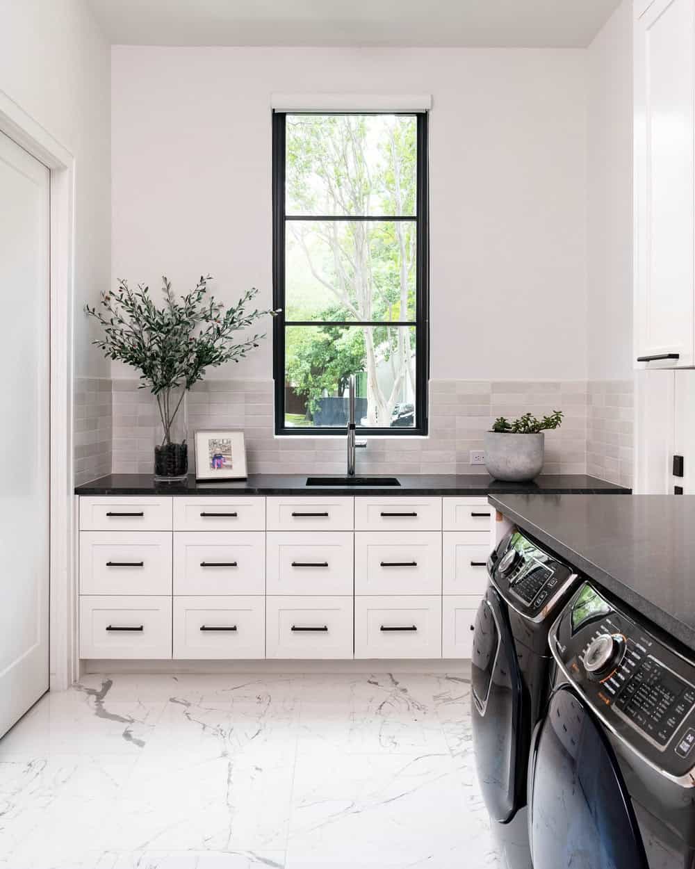 black and white tile laundry room