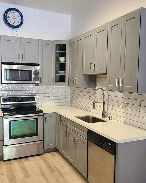 white subway tile backsplash with grey grout feature