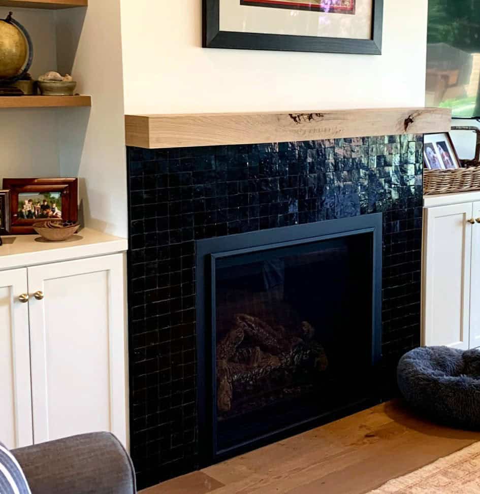 black fireplace with white walls