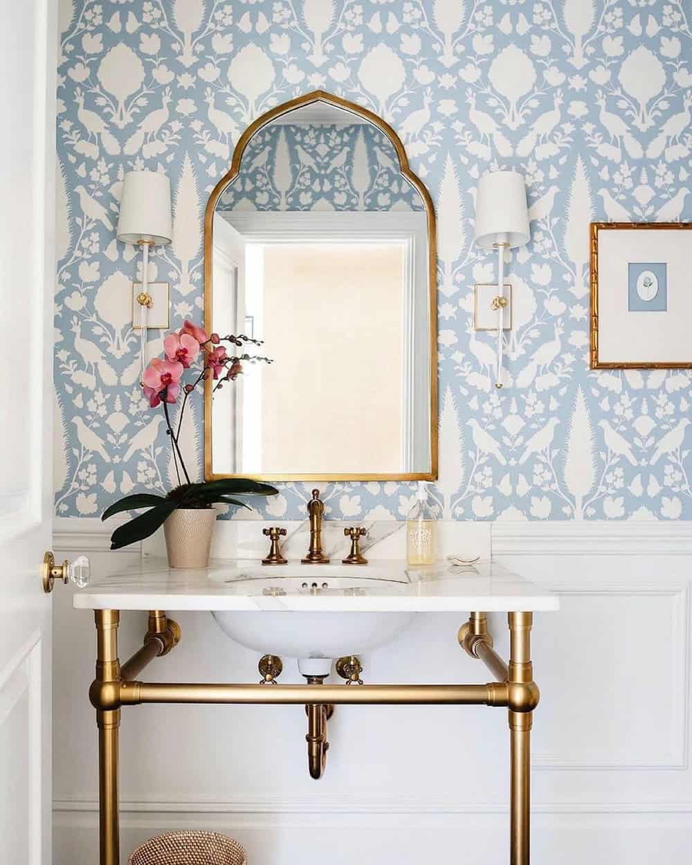 powder room with wainscoting and wallpaper