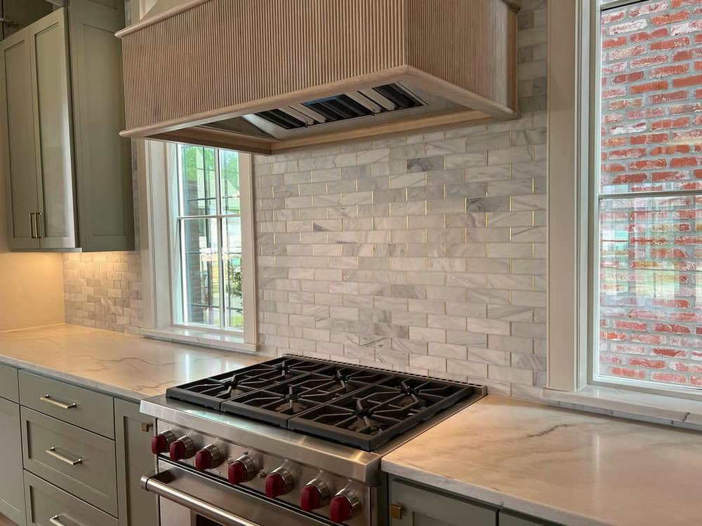 white subway tile gold grout