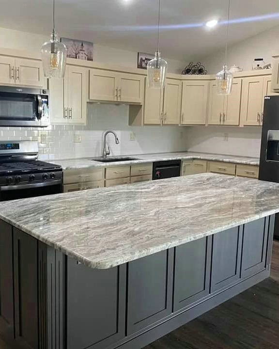 grey granite countertops with white cabinets feature