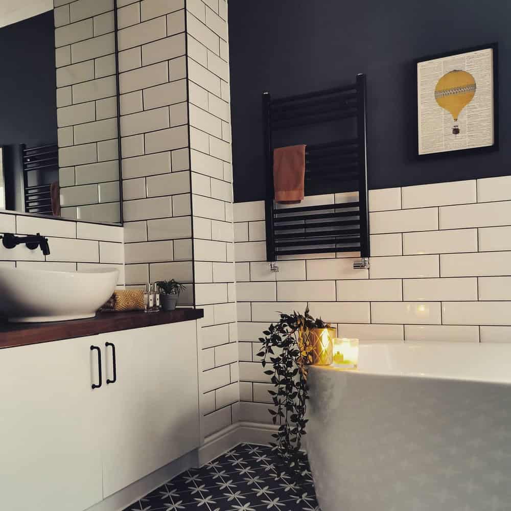 white subway tile with black grout bathroom