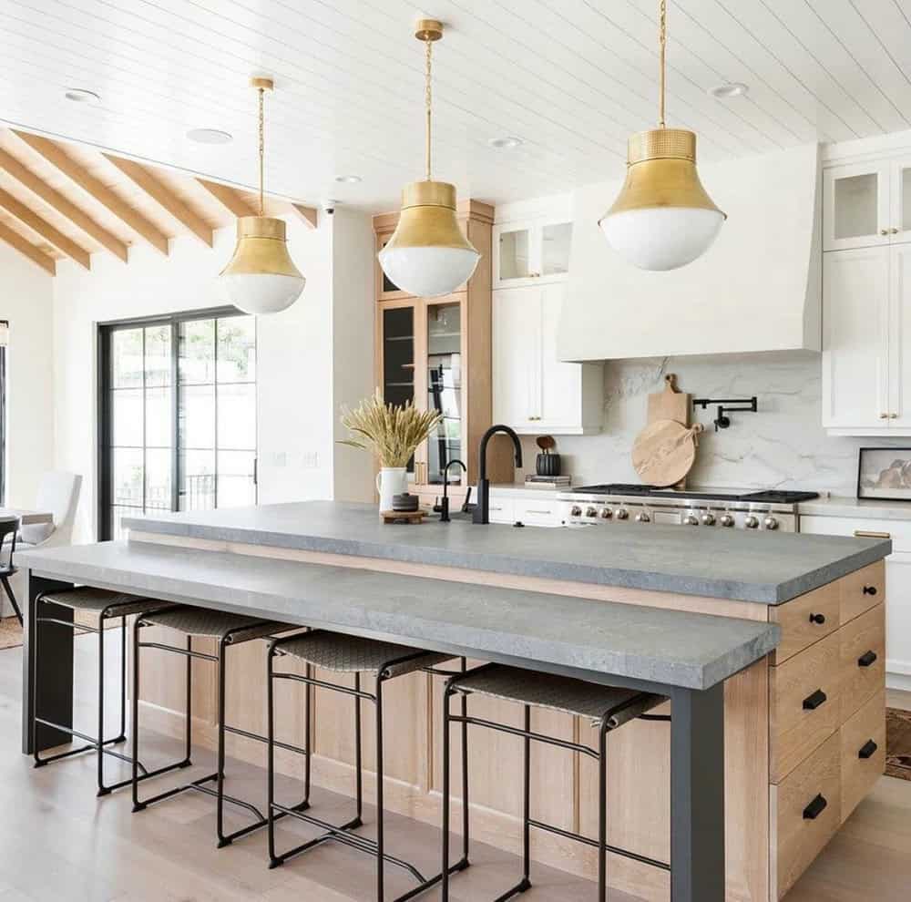 backsplash with grey countertops and white cabinets