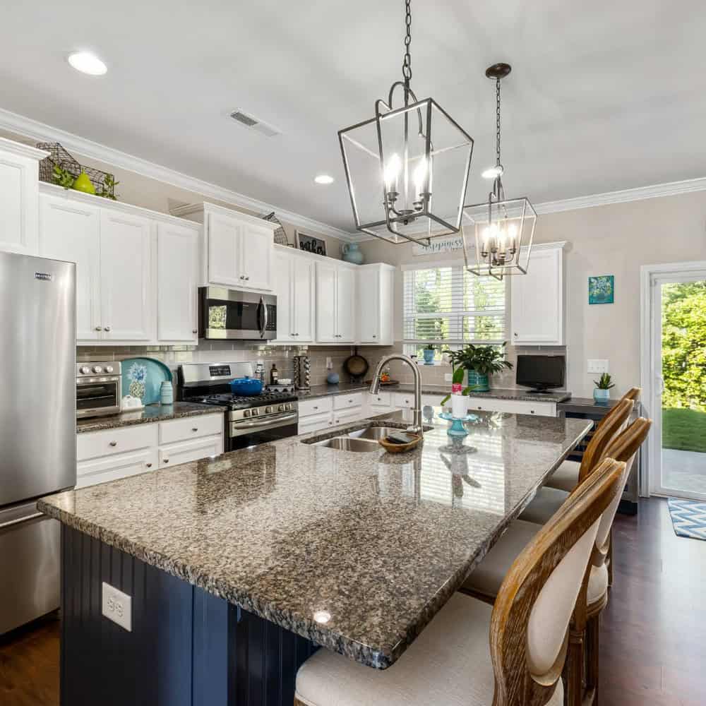 gray granite countertops with white cabinets