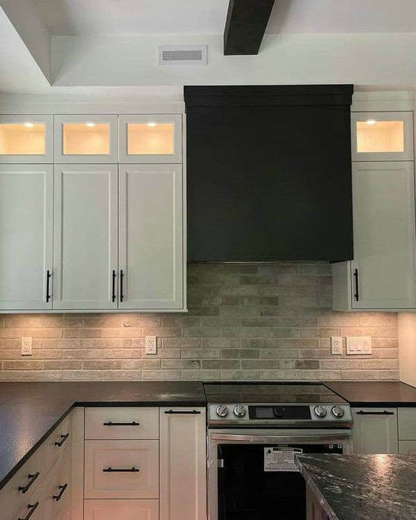 white shaker cabinets with granite countertops feature