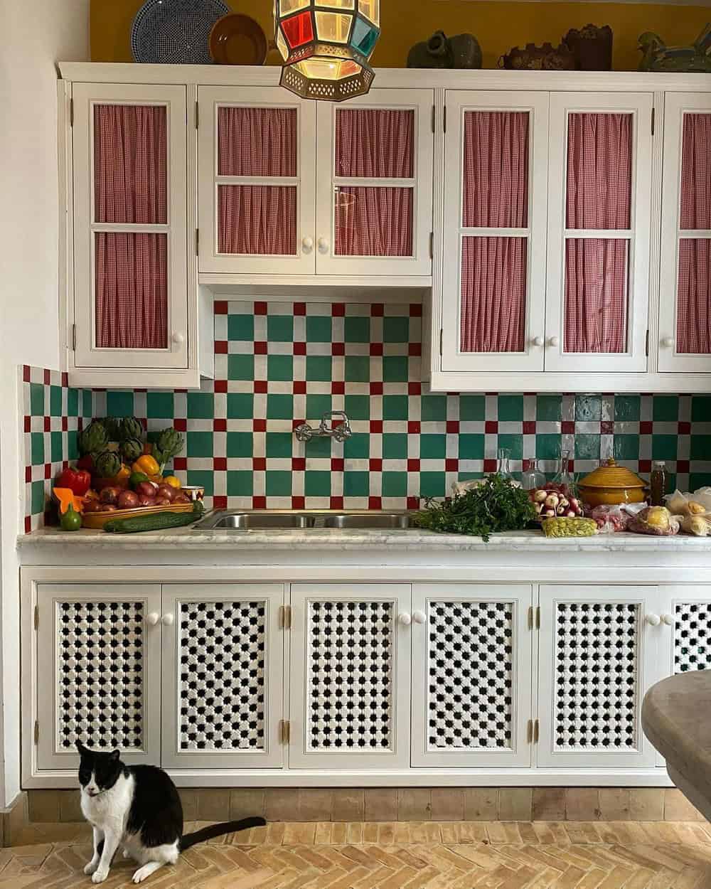 colorful backsplash with white cabinets