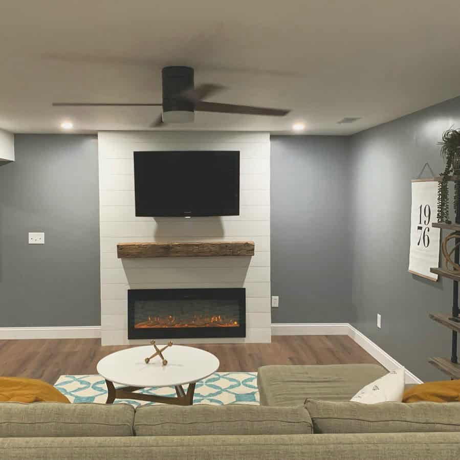 basement entertainment center with fireplace