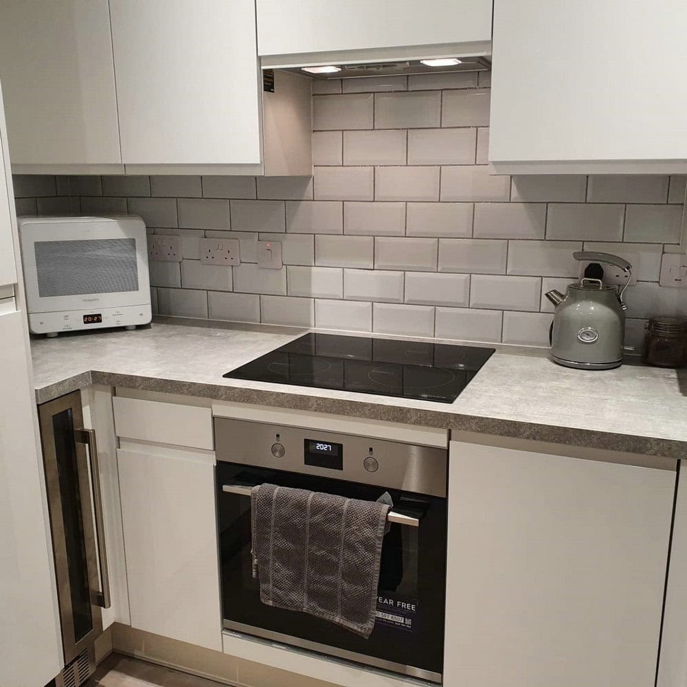 white subway tile with silver grout