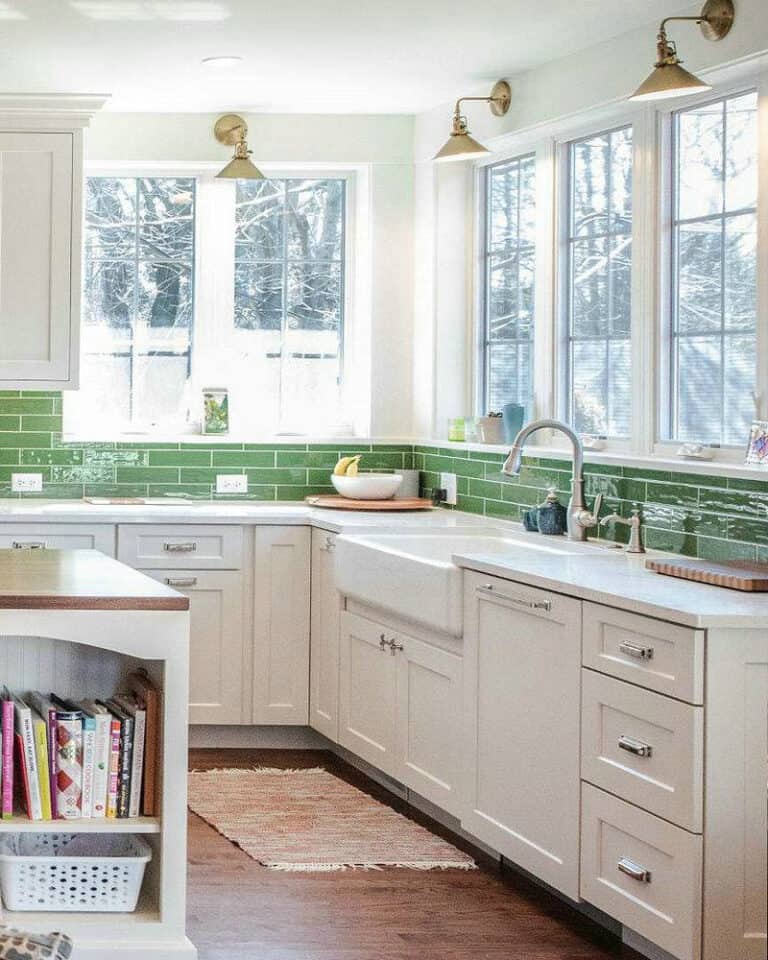 white kitchen with silver hardware feature