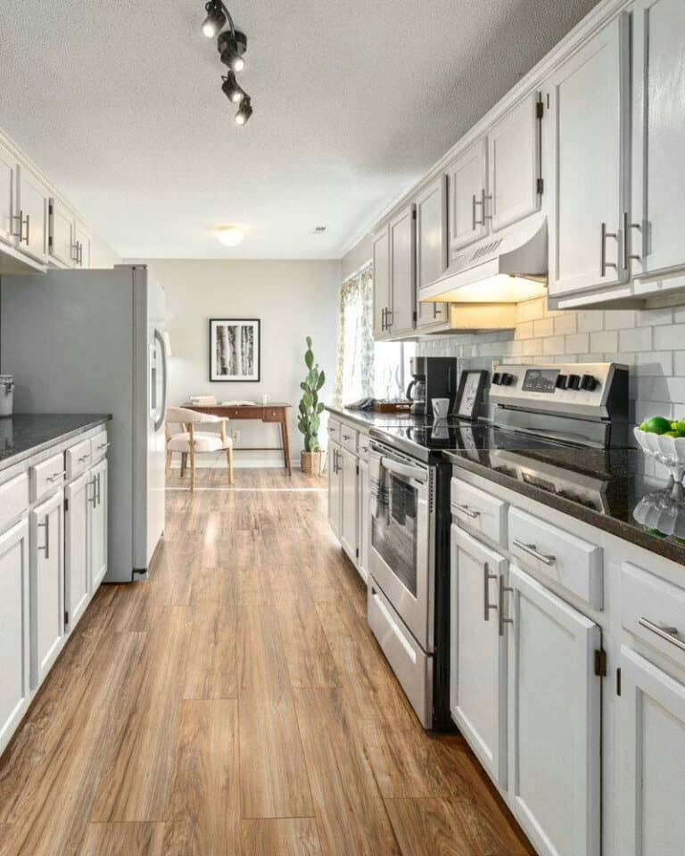 white cabinets with black quartz countertops feature