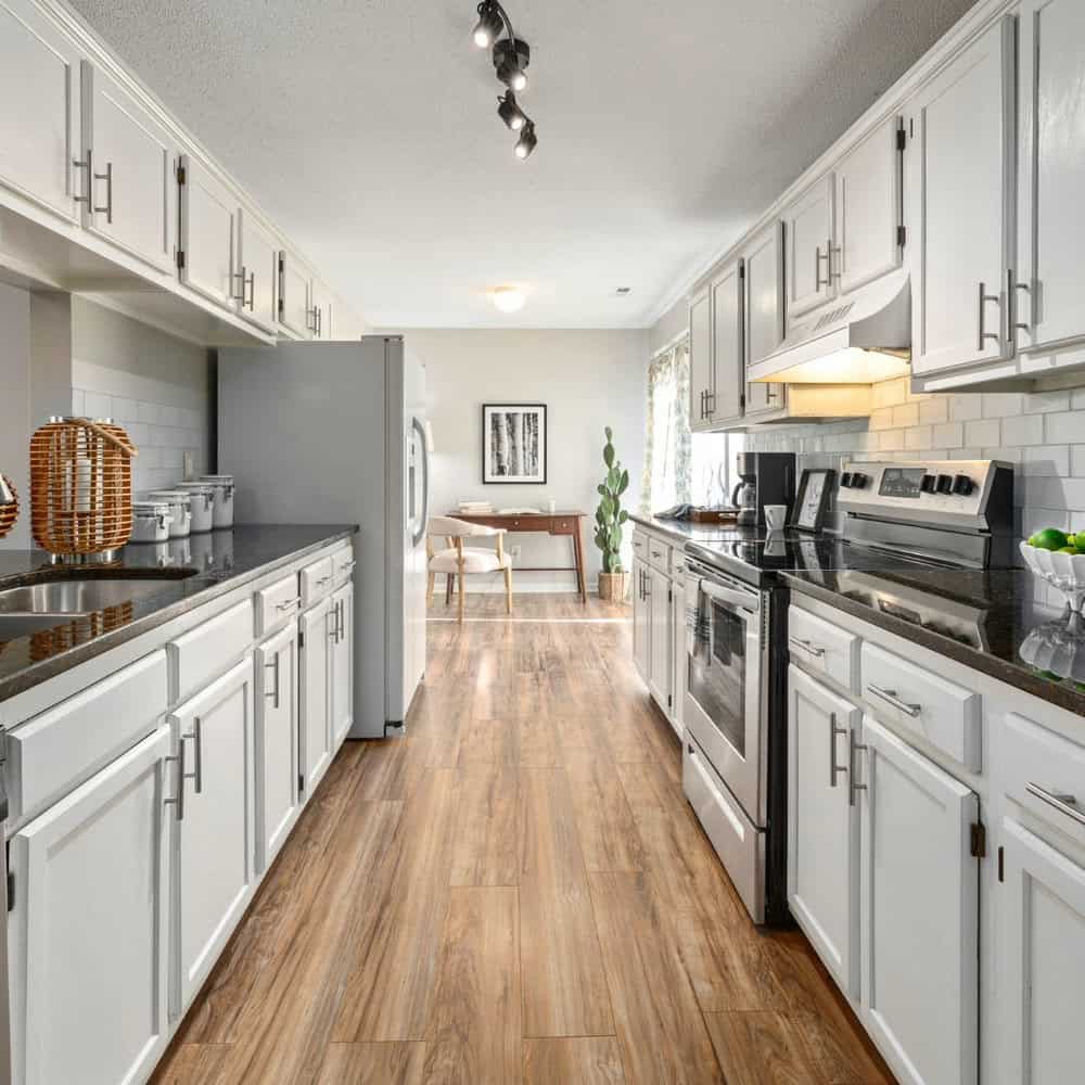 white cabinets with black quartz countertops