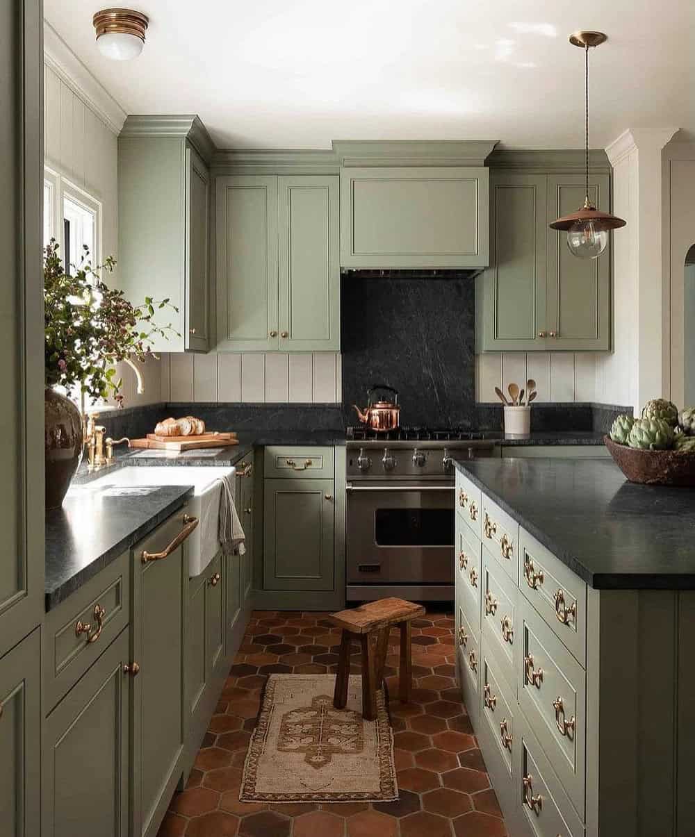 olive green kitchen cabinets with black countertops