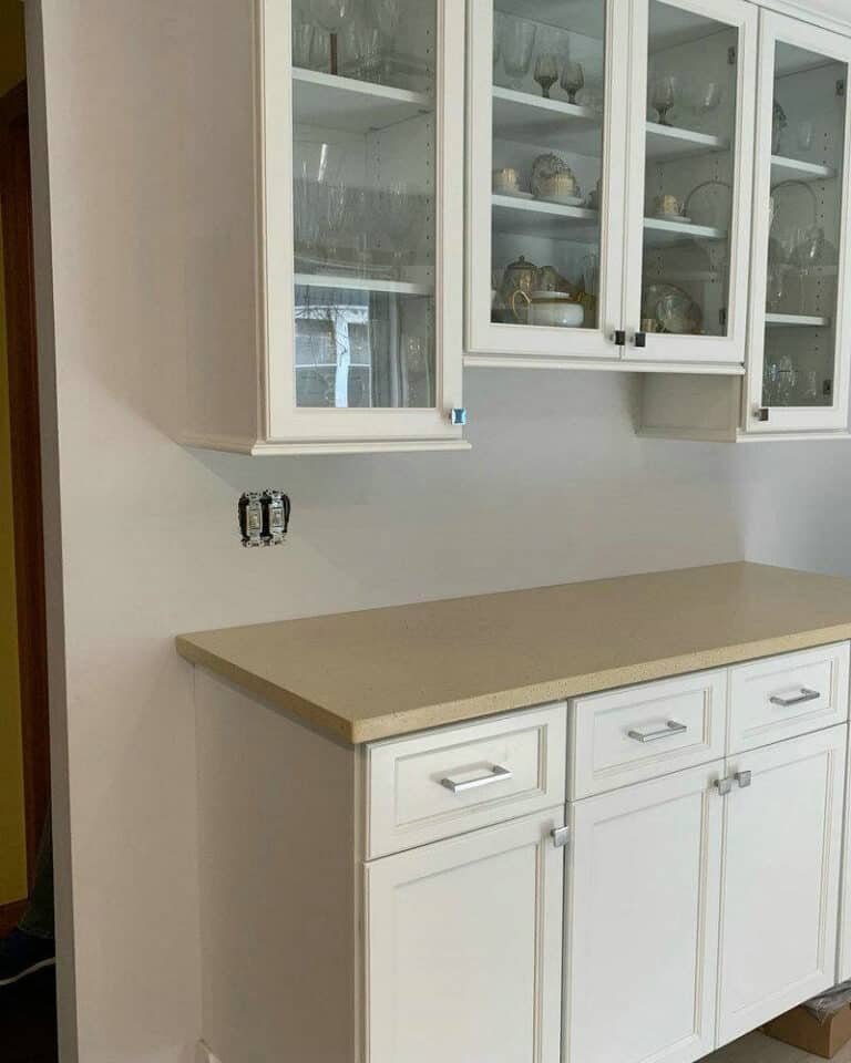 white cabinets with beige countertops feature