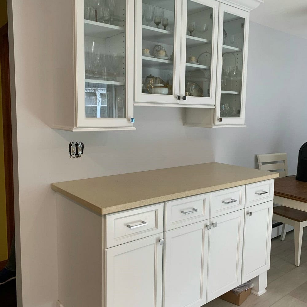 white cabinets with beige countertops