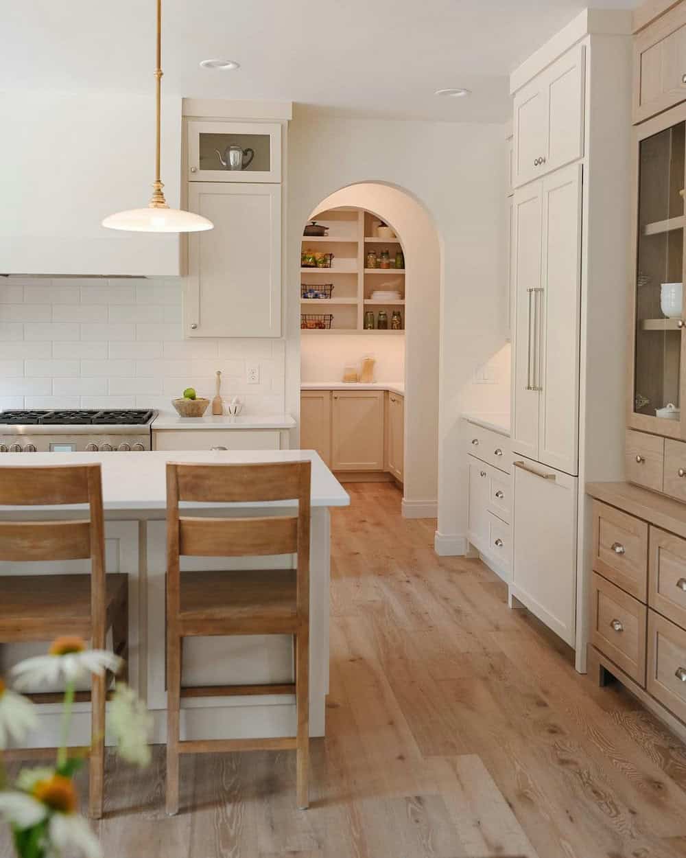 tan cabinets with white countertops