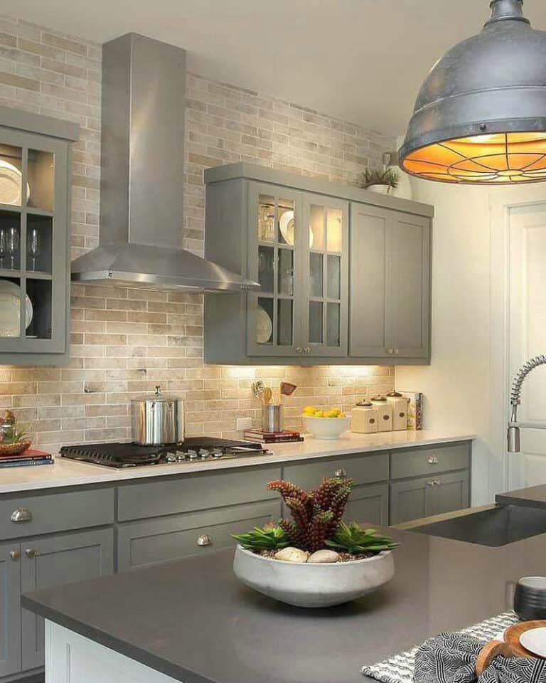 light gray cabinets with black countertops feature