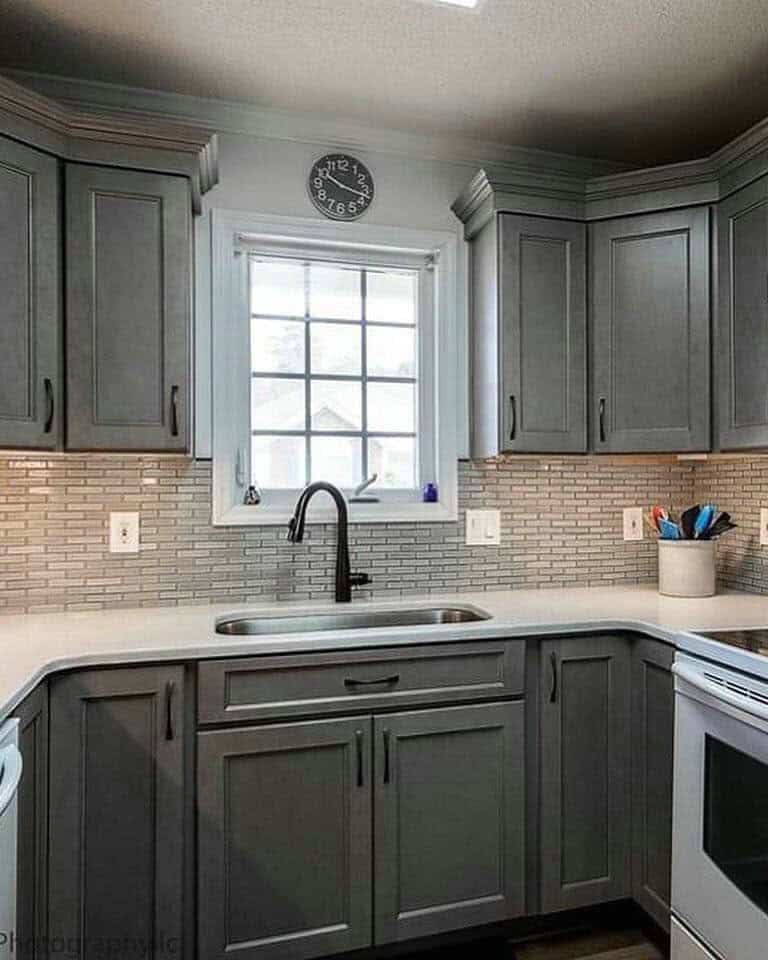 light grey kitchen cabinets with white countertops feature