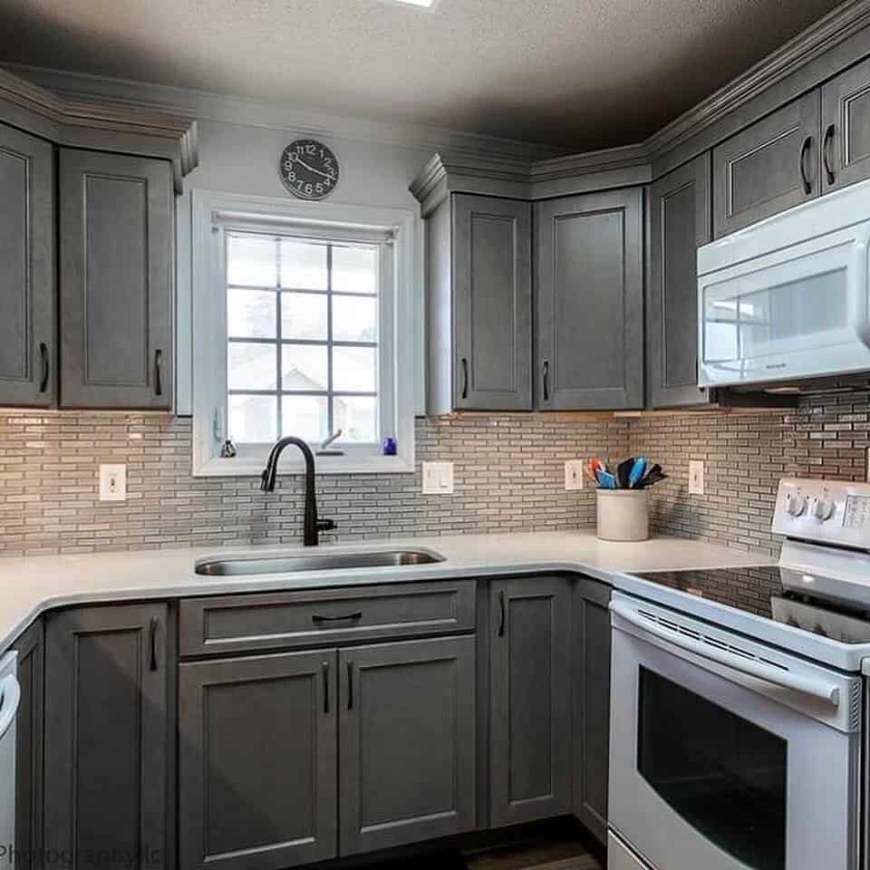 light grey kitchen cabinets with white countertops