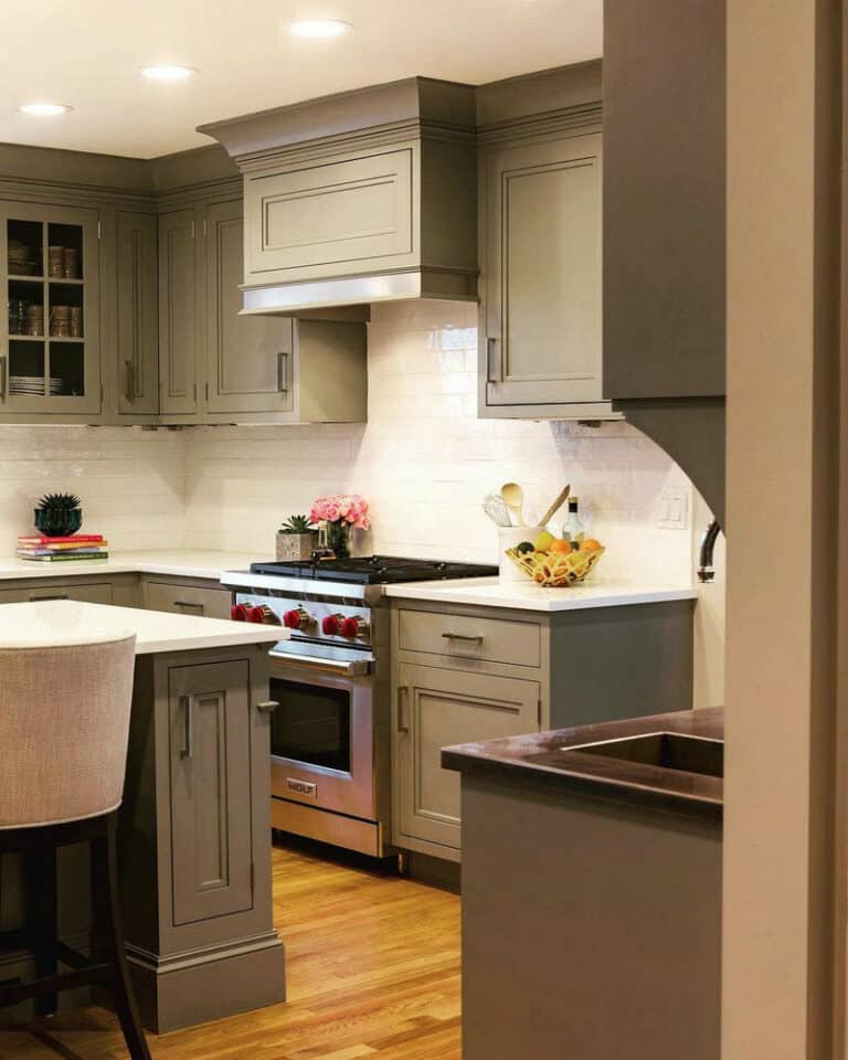 dark grey kitchen cabinets with white countertops feature