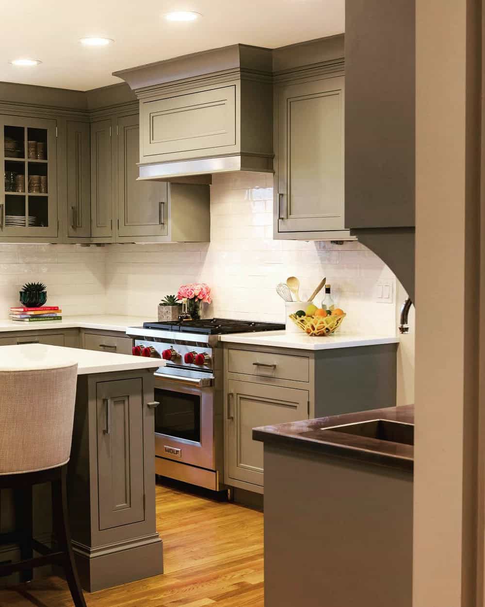 dark grey kitchen cabinets with white countertops