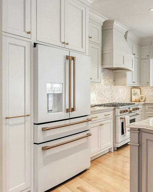 gold handles on white cabinets feature