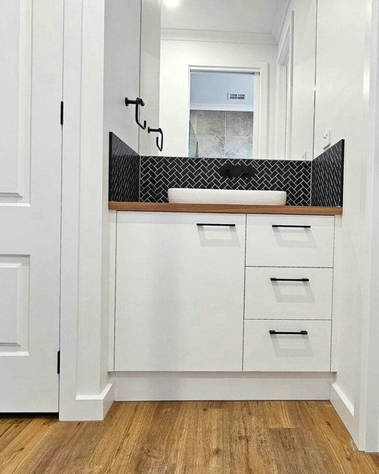 white cabinets with black pulls feature