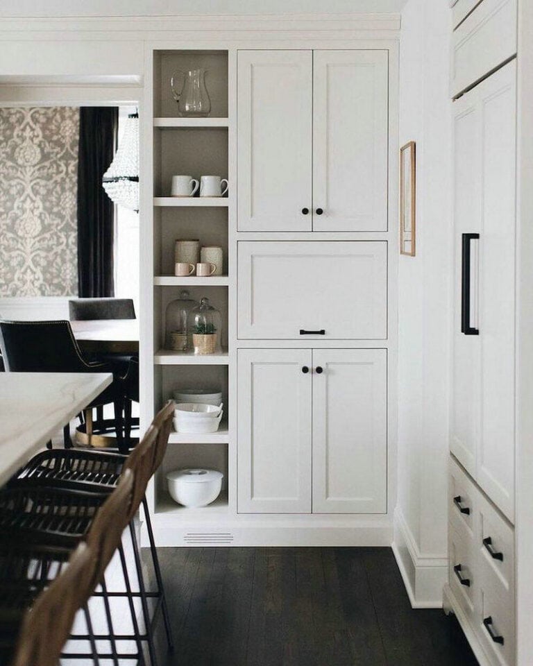 white shaker kitchen cabinets with black hardware feature