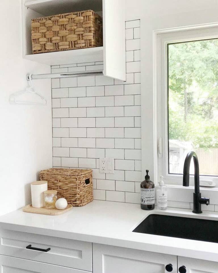 white subway tile with charcoal grout feature