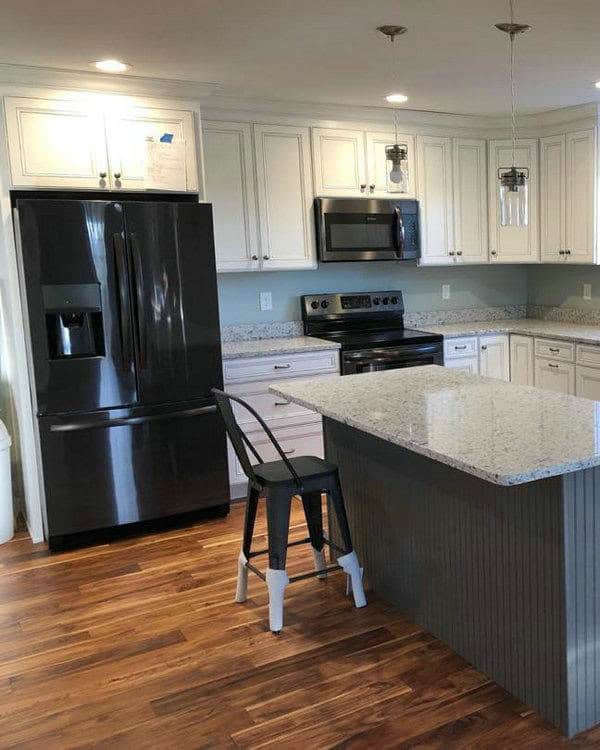 ornamental white granite with white cabinets feature