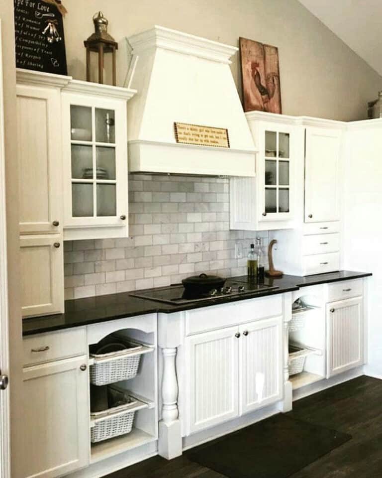 steel gray leathered granite with white cabinets feature