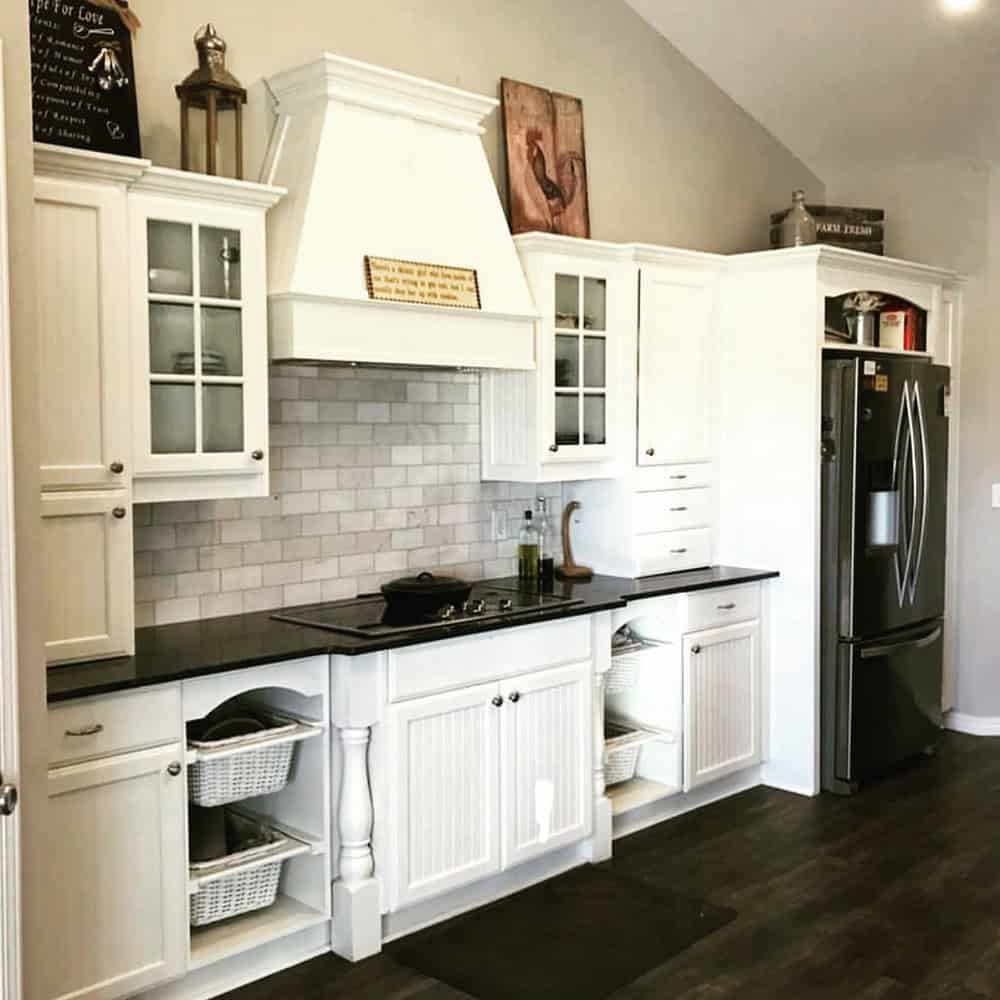 steel gray leathered granite with white cabinets