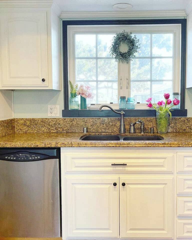 brown granite countertops with white cabinets feature