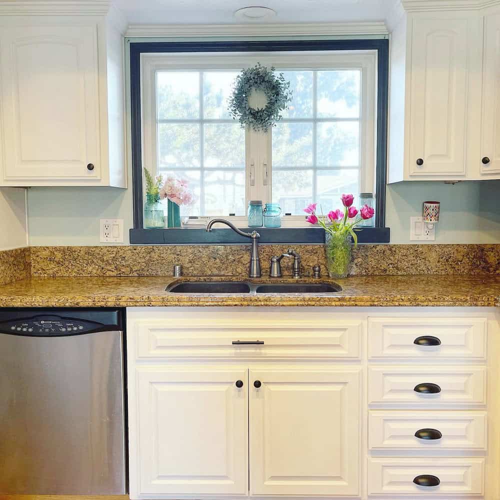 brown granite countertops with white cabinets