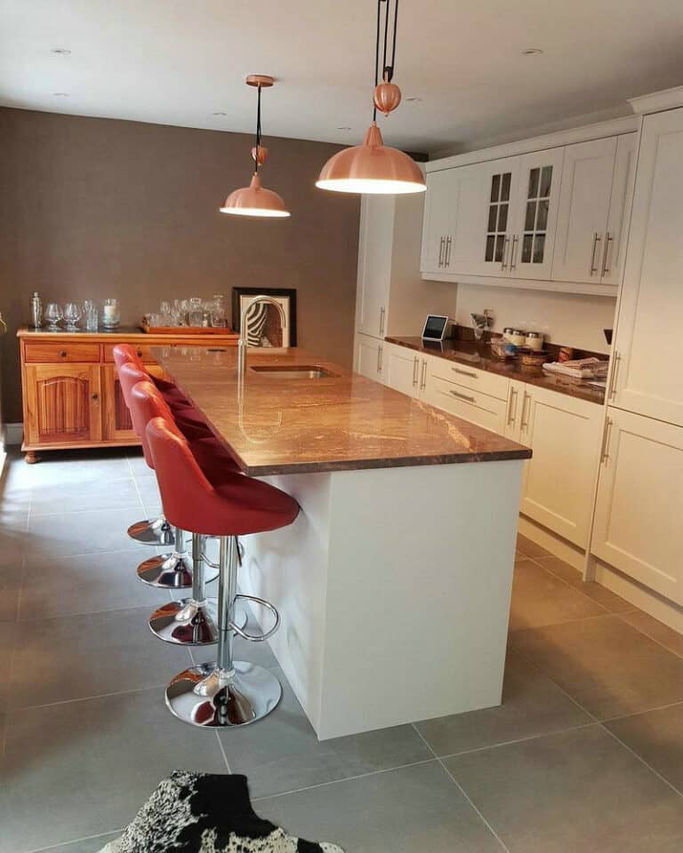 white kitchen cabinets with brown granite countertops feature