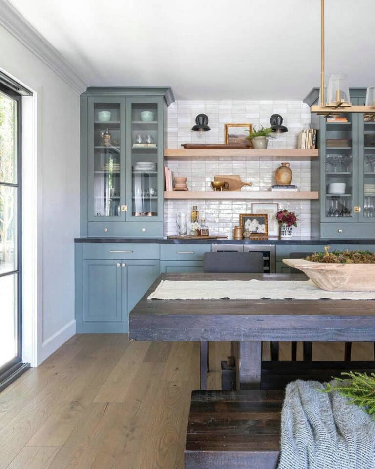 grey kitchen cabinets with black granite countertops feature