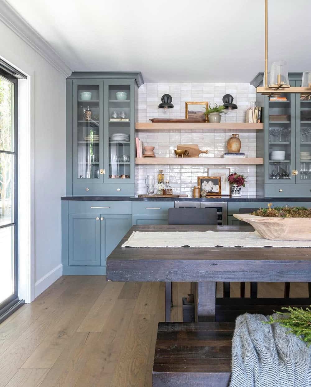 grey kitchen cabinets with black granite countertops