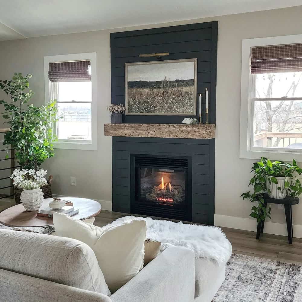 black fireplace with white walls