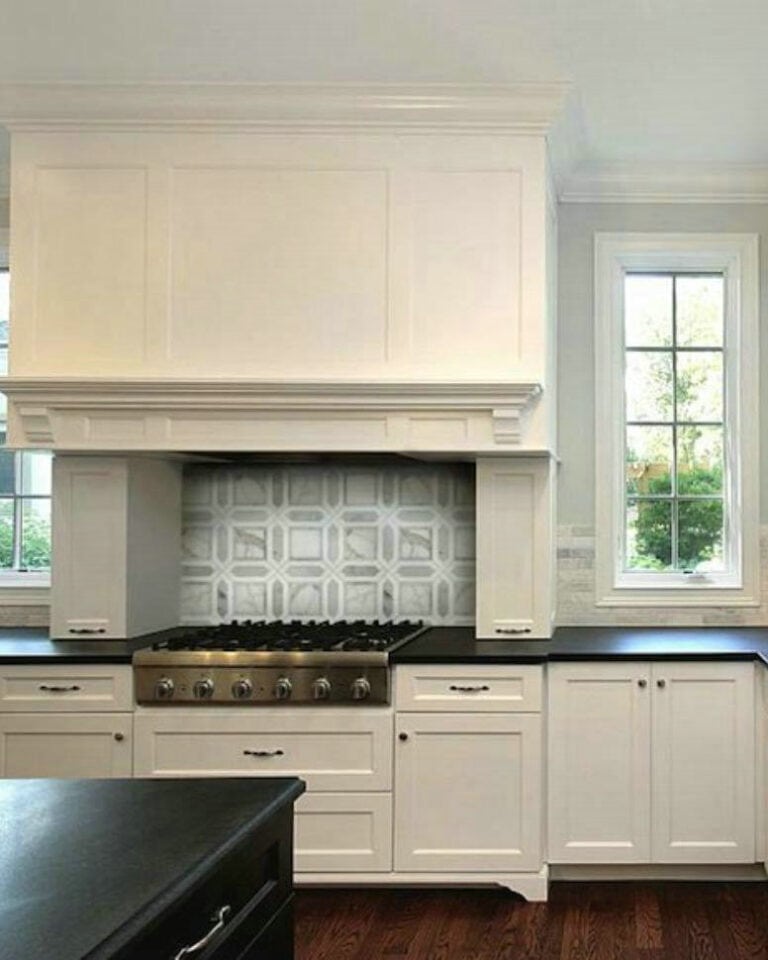 kitchen backsplash with black granite countertops and white cabinets feature