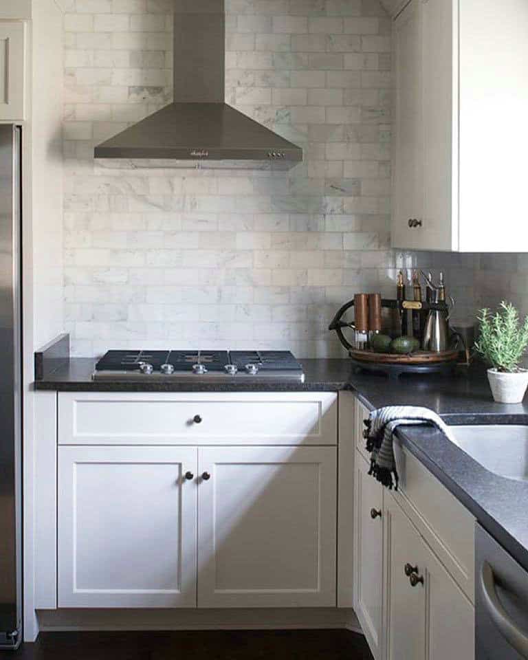 dark gray backsplash white cabinets feature