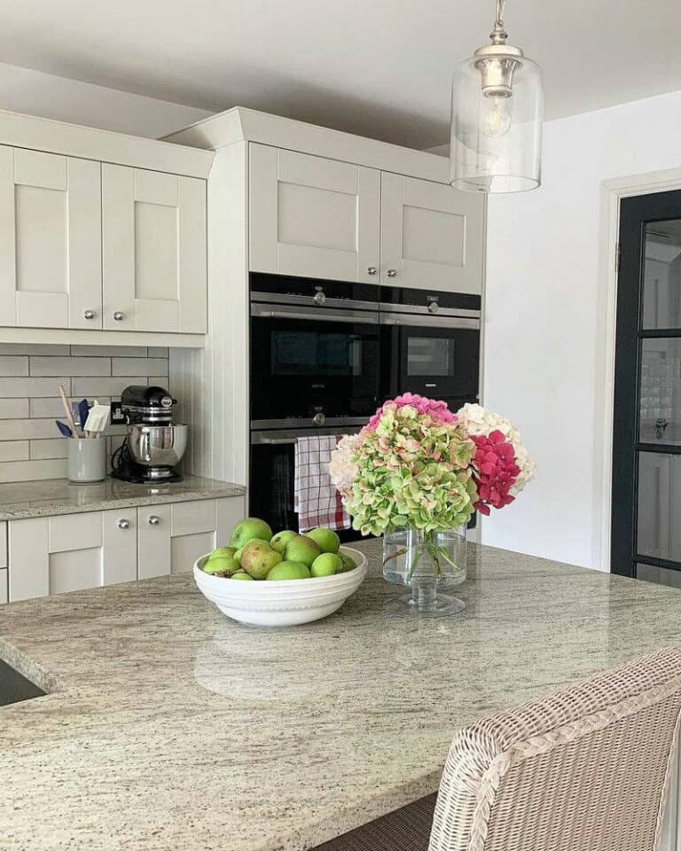 beige granite countertops with white cabinets feature