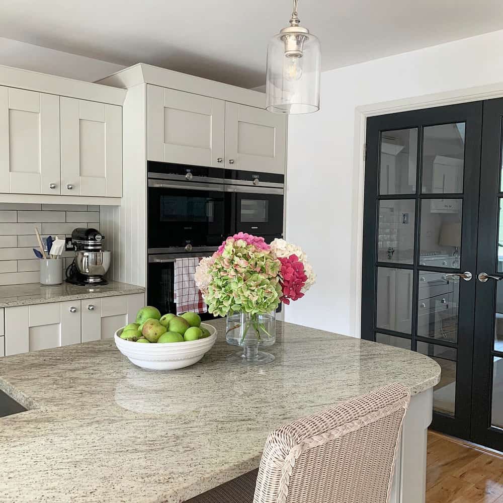 beige granite countertops with white cabinets