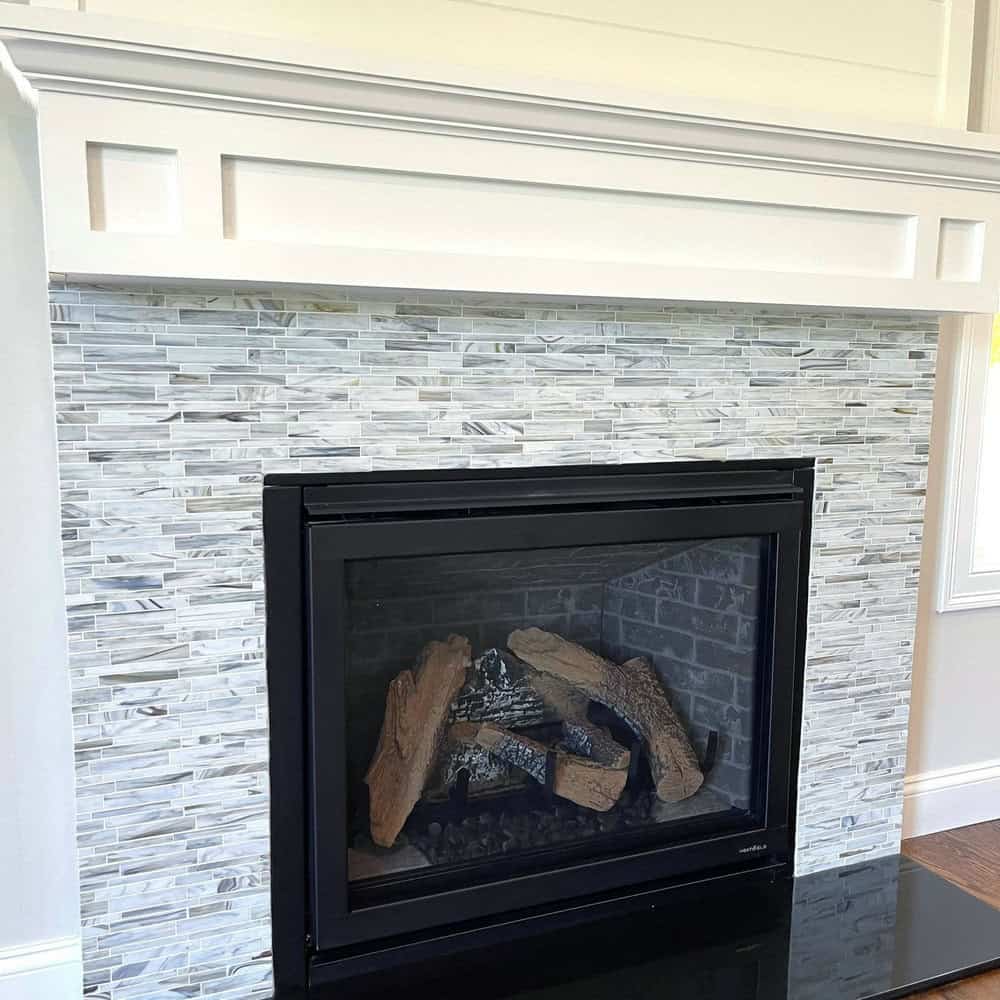 accent wall in living room with fireplace