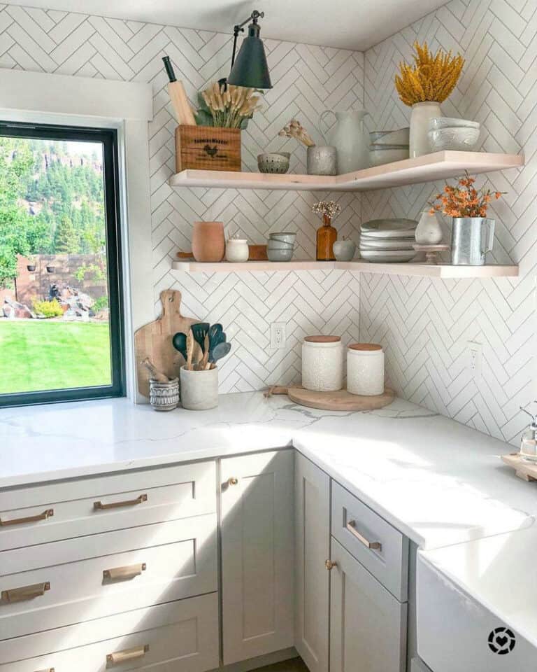 white herringbone backsplash with black grout feature