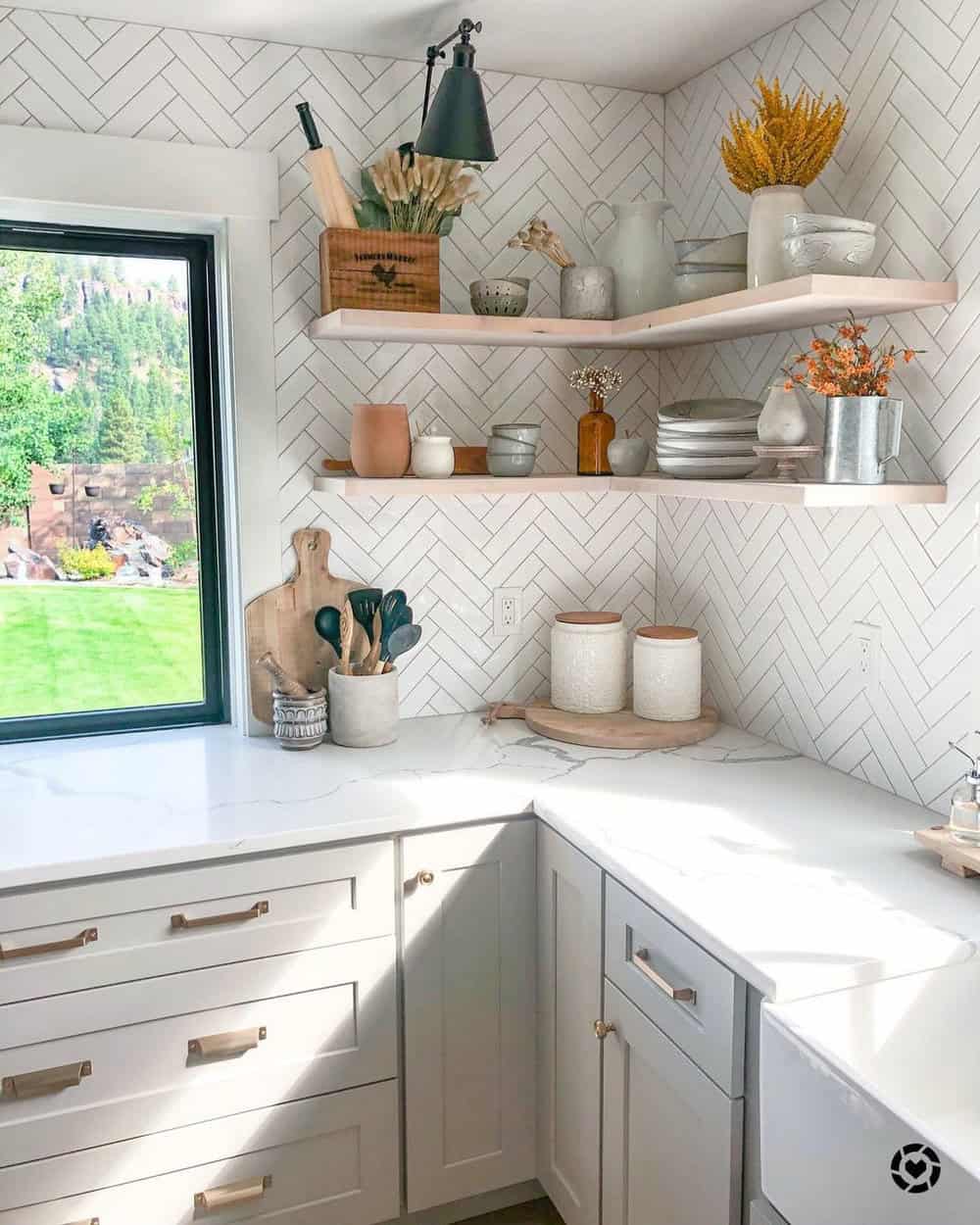 white herringbone backsplash with black grout