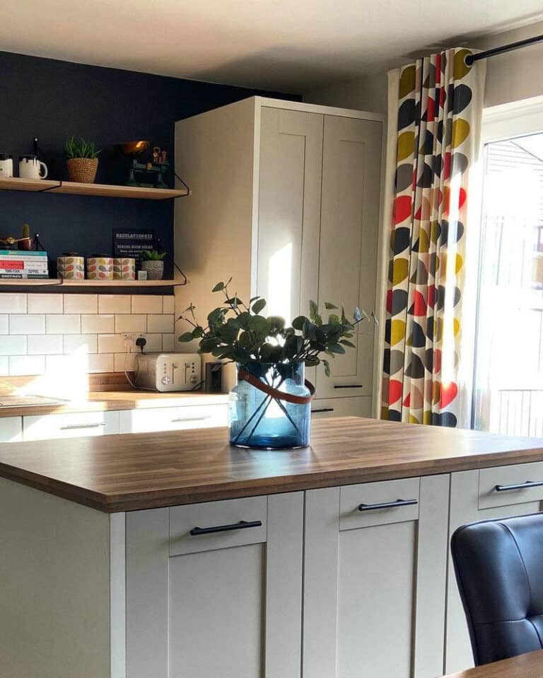 white subway tile black grout kitchen feature