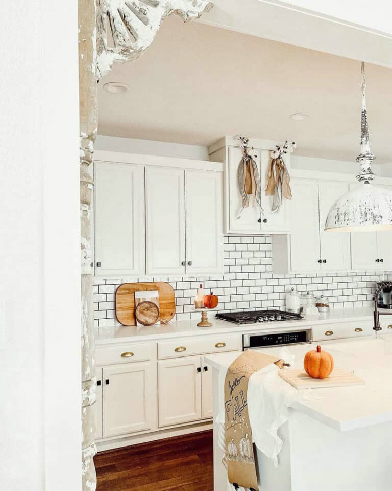 white tiles with black grout kitchen feature